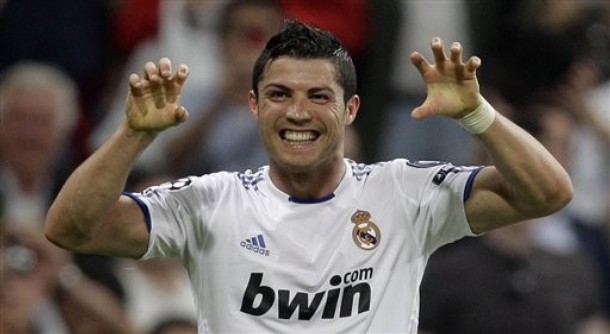Real Madrid's Cristiano Ronaldo from Portugal reacts after scoring against Tottenham Hotspur during a quarter final, 1st leg Champions League soccer match at the Santiago Bernabeu stadium in Madrid, Tuesday April 5, 2011. Real Madrid won the match 4-0. (AP Photo/Paul White)
